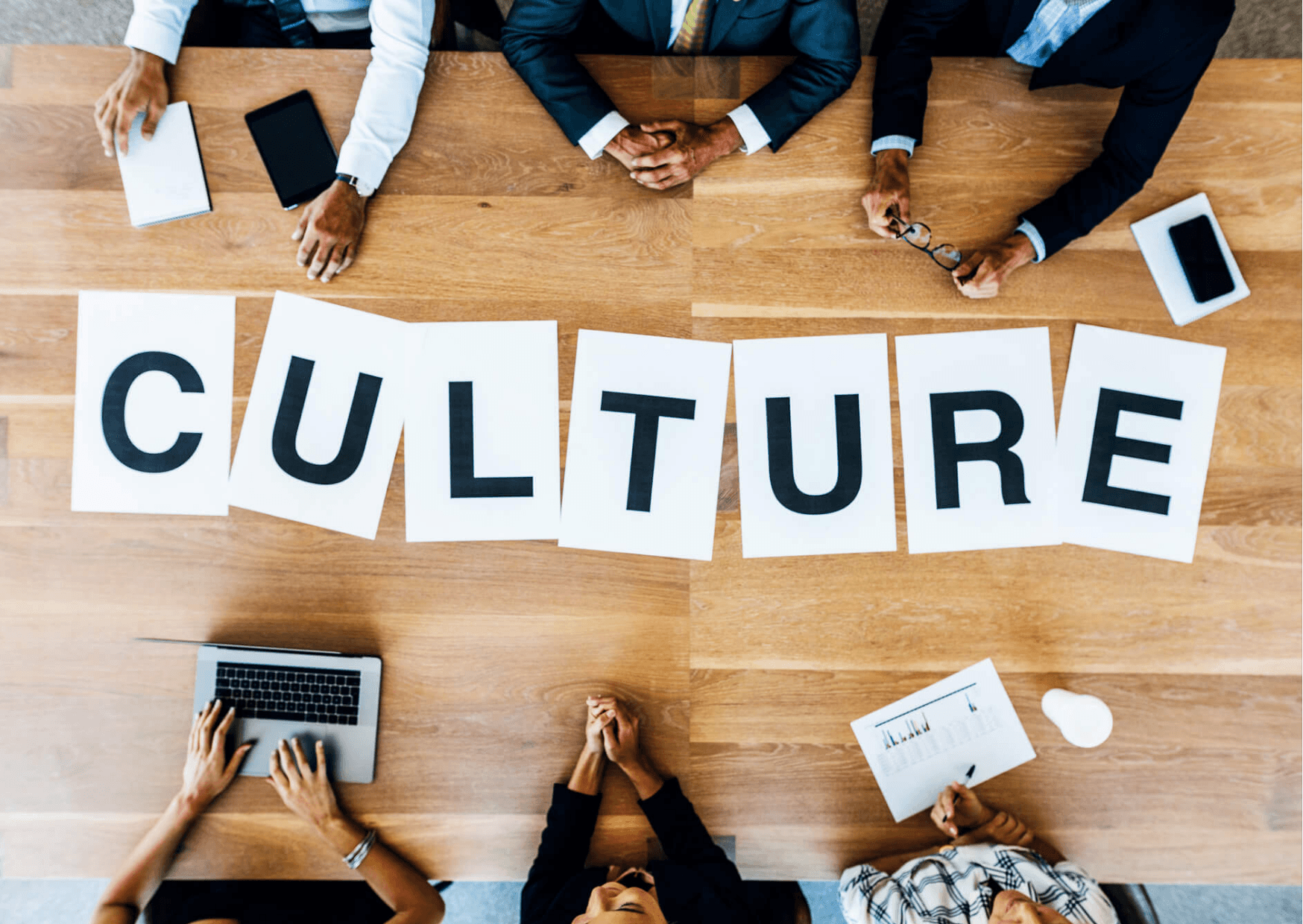 Employees discussing company culture and workplace values during a team meeting