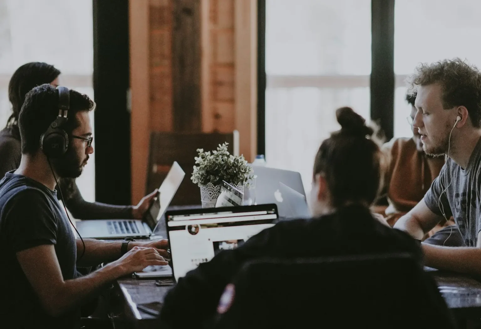 Technology specialists working together in a meeting room
