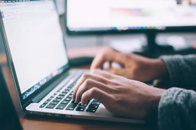 Technology professional searching for career and job opportunities in South Africa on their laptop