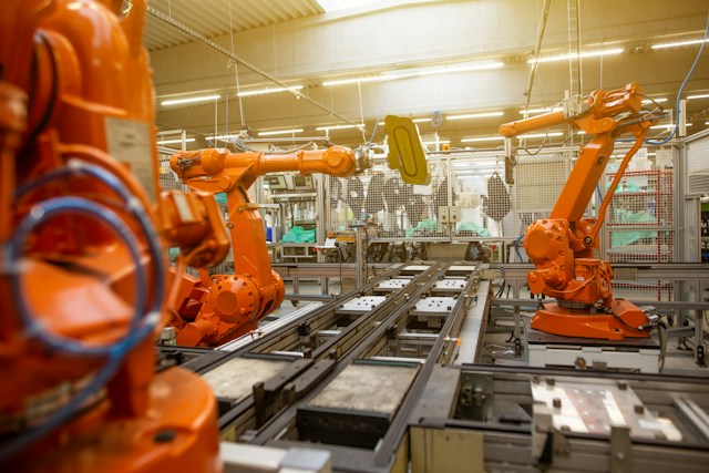 Robotic arms on a manufacturing assembly line, the production operations an ERP system controls
