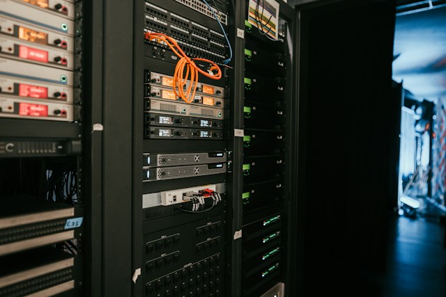 Server racks with patch cabling, the platform layer an ERP estate runs on