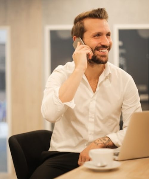 usiness leader on a call reviewing hiring plans, supported by Acuity Advisory market intelligence and salary benchmarking